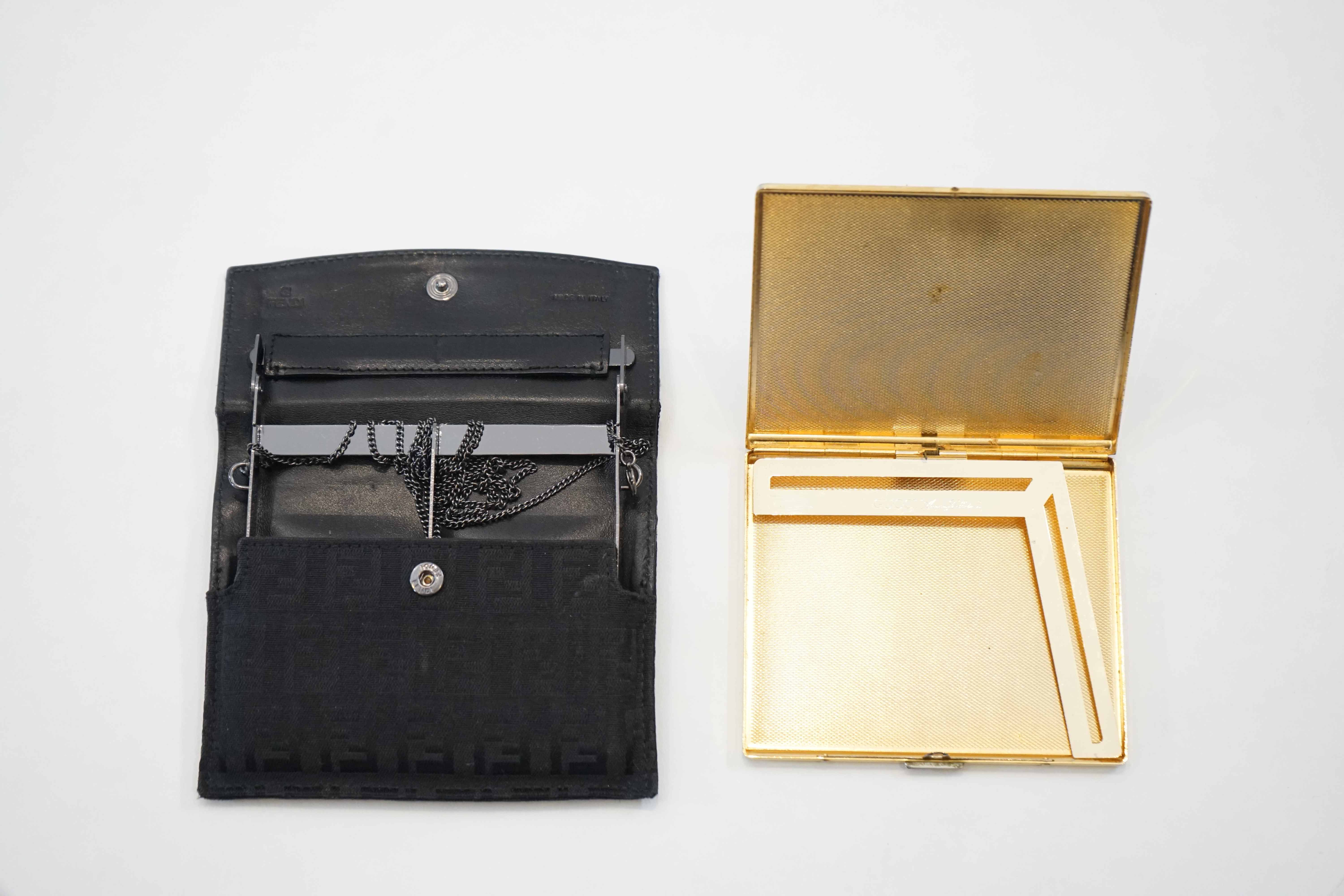 Four Vintage cigarette cases; Fendi, Gucci and two Dior
